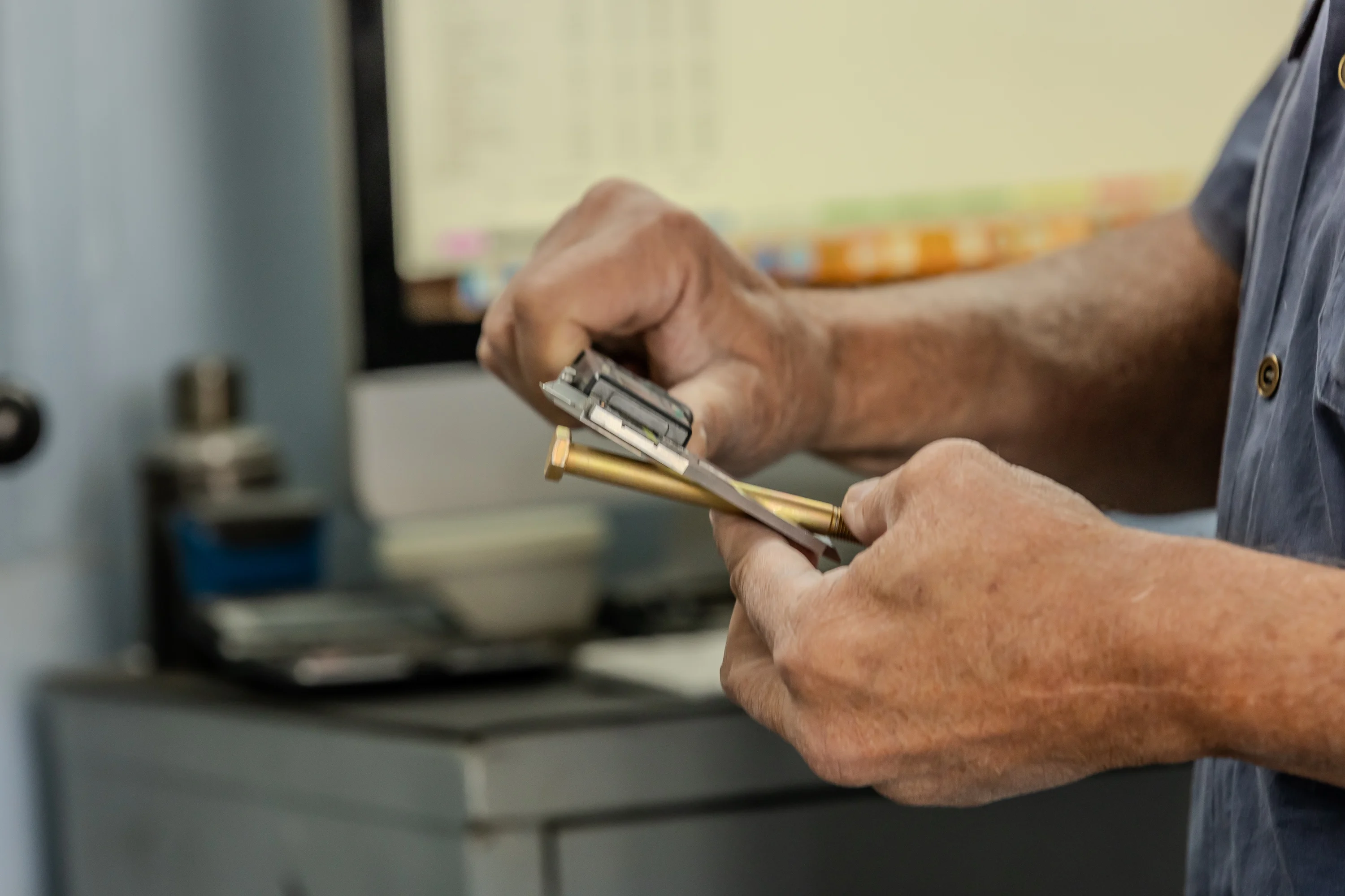 Small propeller component being checked by hand